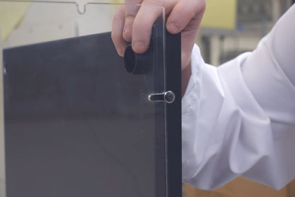 Slot back panel into side panels using the hole and slots provided