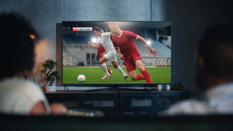 OLED TV displaying football match with score counter on screen, this is an area subject to OLED burn-in