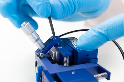 Remove the y-axis micromanipulator micrometer screws