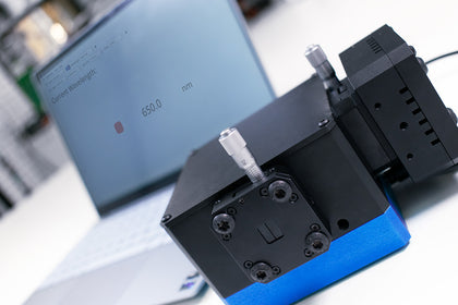 Adjustable slit attached to monochromator