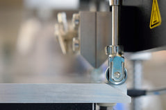 Move the stage so that the gauge rollers are no longer in contact with the stage