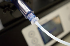 Female end of the PTFE dispensing tube connected to the syringe