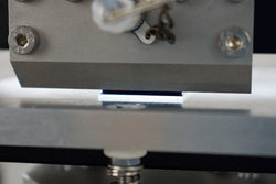 Substrate with a meniscus formed on it from the head