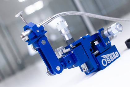 Universal Tool Clamp securing Optical Fiber
